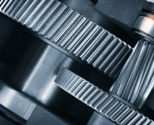 A Close Up Of A Machine With Gears And A Large Gear In The Middle