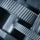 A Close Up Of A Machine With Gears And A Large Gear In The Middle
